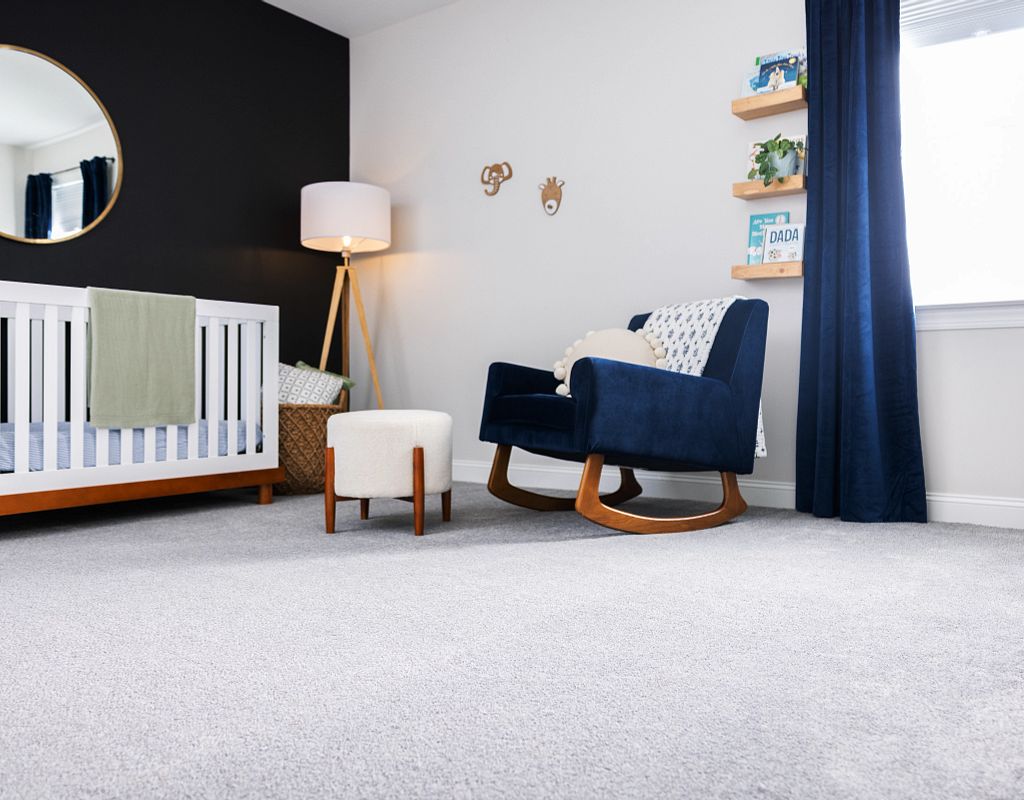 Blue chair on white carpet | Ultimate Flooring Design Center